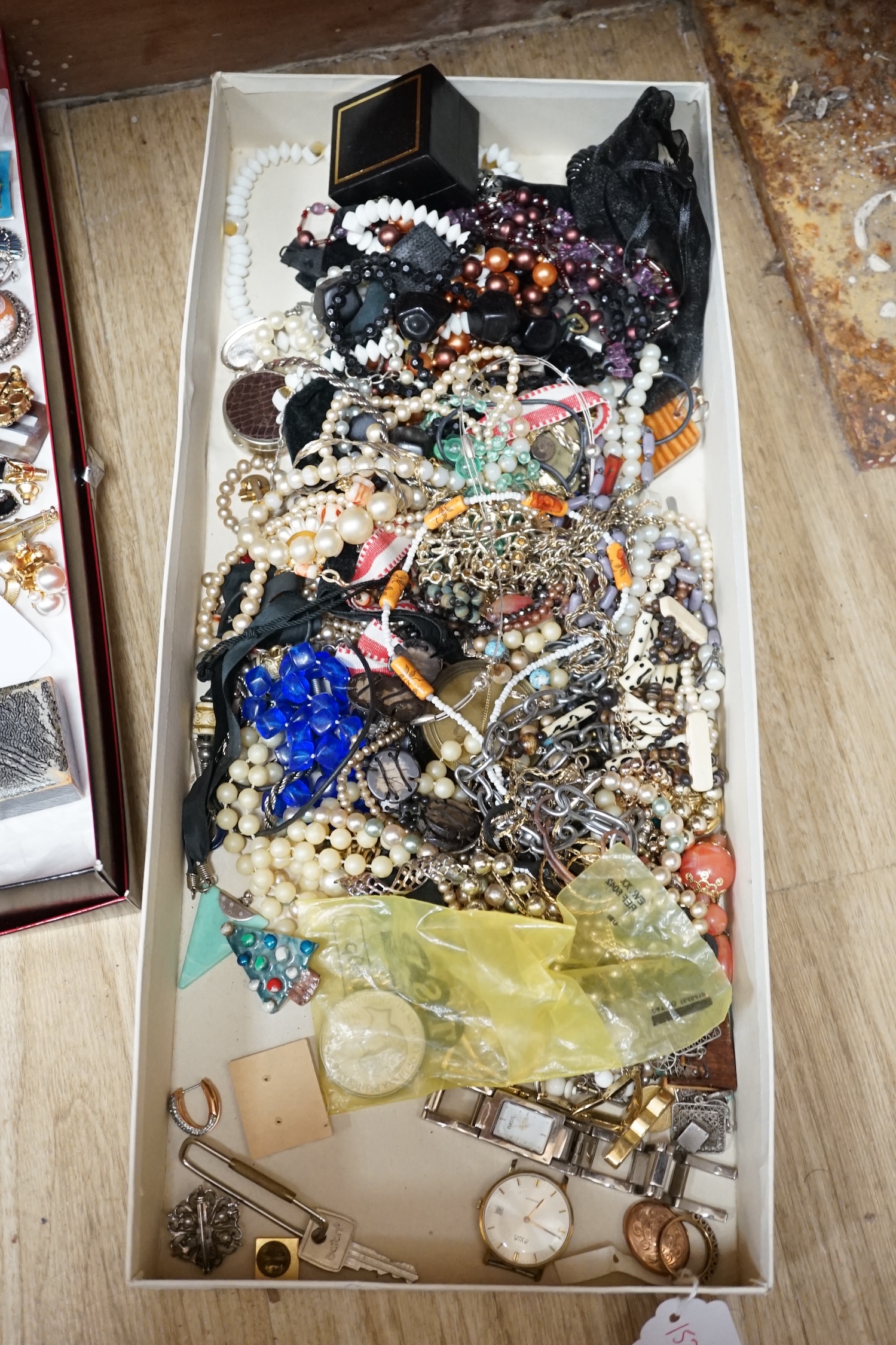 Assorted jewellery including mainly costume, a modern 9ct gold, ruby and diamond chip ring, a 9ct back and front locket, etc. Condition - poor to fair